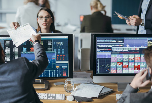 Traders working on computers