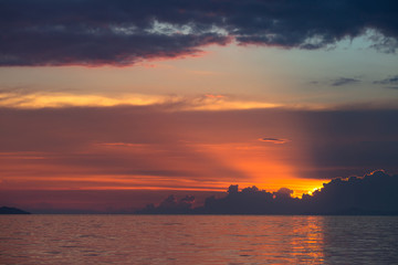 sun rays with storm clouds on the sea.Sunset in Thailand