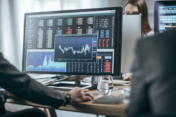 Businesspeople working with finance forecasts on their computers