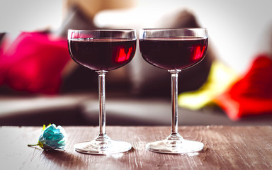 two glasses of red wine on a  table