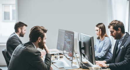 Brokers working at their office.