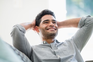 Thoughtful man relaxing on sofa