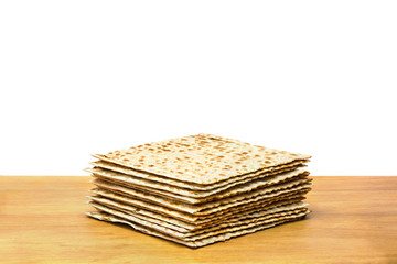 Matzo on the wooden table on white background
