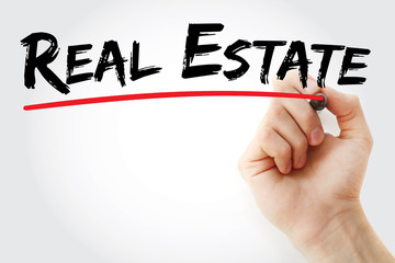 Hand writing Real estate with marker, concept background