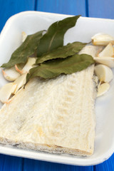 salted cod fish on white dish