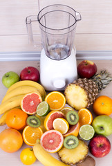 Blender with group of fruits