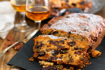 cake with dry fruits on brown plate