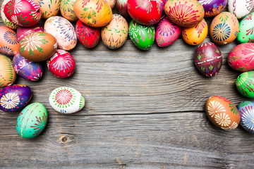 Top View Dyed Colorful Easter Eggs on Wooden Background.
