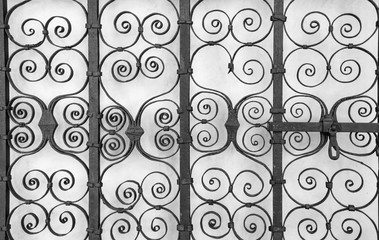 Ornate old fence - close up, black and white.