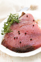 raw tuna with black pepper on white dish