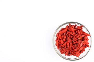 dried goji berries in a small glass bowl