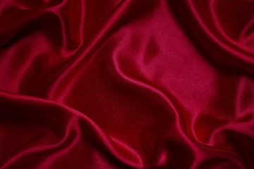 Red cloth waves background texture.