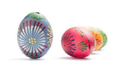Colorful Easter Eggs with Wax Ornaments Isolated on White Background