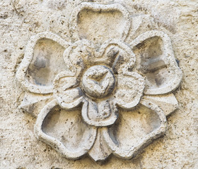 Pattern of flower carved on stone.