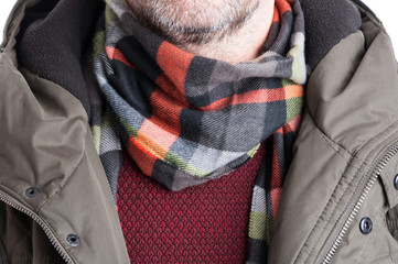 Close-up of man wearing comforter sweater and jacket