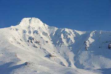 The Pyramid mountain near the Soviet abandoned town Pyramiden, which is located on Svalbard...