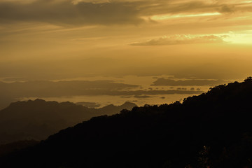 Beautiful freshwater lagoon with mountains island at sunset.