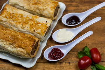 Meat and vegetable pies on the wooden table