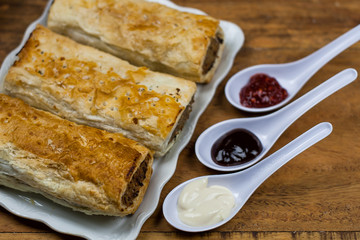 Meat and vegetable pies on the wooden table