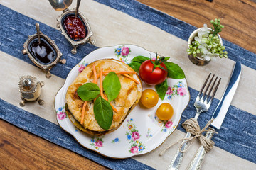 Meat and vegetable pies on the wooden table