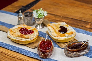 Meat and vegetable pies on the wooden table