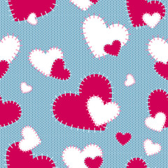 Seamless vector pattern sewn red and white hearts on a blue knitted background. Handmade. Background forValentine's Day.