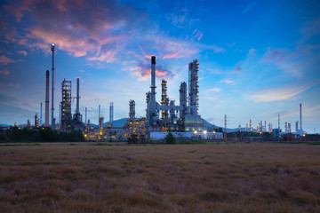 Fototapeta na wymiar Oil refinery industry at sunrise, Oil refiner Industry background concept
