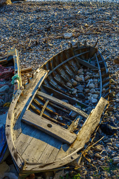 Old Boats on a beach of Capo Milazzo, Sicily, Italy