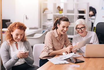 Involved positive businesswomen creating the project at work