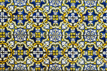 Gorgeous seamless pattern from dark blue yellow and white Moroccan, Portuguese tiles, ornaments. Can be used for wallpaper, pattern fills, web page background,surface textures.