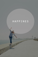 Beautiful young hipster woman walking near sea with raised hands. Oval insert with happiness sign