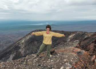 Beautiful young woman standing on the edge of the 2nd crater of the Northern breakthrough 1975...
