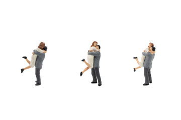 Miniature couple hugging