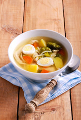 Chicken noodle soup with broccoli and quail eggs