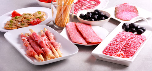 Mix of meat products and  appetizers served