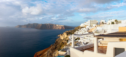 Santorini island, Greece, Oia village on misty morning, panorama