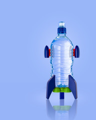 Water bottle in the form of a rocket on blue background