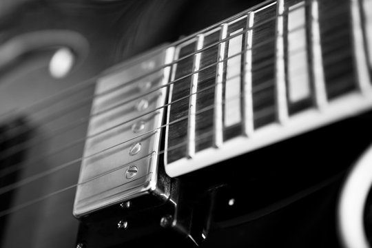 Strings electric guitar closeup in black and white