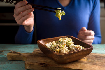 Woman eating  kimchi horizontal