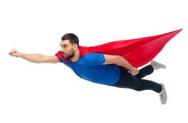 man in red superhero cape flying on air