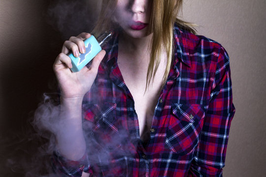 girl smoking vape (e-cigarette, electronic cigarette) 