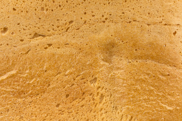 Closeup crust of bread. Bread as background.