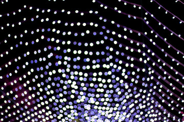 Dark blue shiny bokeh abstract background from night light.