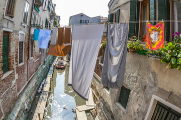 clothes on a clothesline in a narrow street in Venice