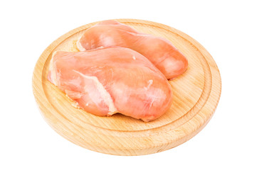 chicken fillet on wooden board