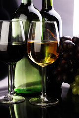 Wine glass and Bottle on black background. Red and white wine