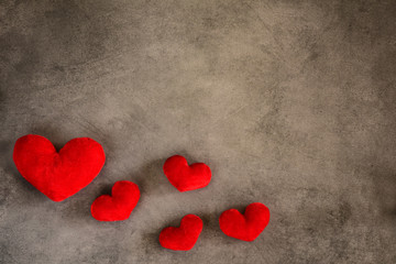 Valentine's Day - red hearts on a gray background