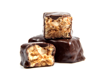 Chocolate candy with nuts isolated on white background.