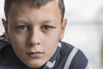 Obraz premium Sad Boy. Teenager with Sad Expression Face Close Up. Depression, Loneliness and Stress Concept.