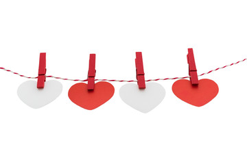 Love Valentine's hearts natural cord and red clips hanging © nipastock